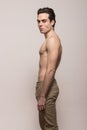 Young man model shirtless body posing pants Royalty Free Stock Photo