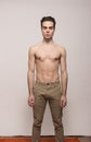 Young man model shirtless body posing pants Royalty Free Stock Photo