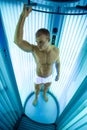 Young man in modern solarium Royalty Free Stock Photo