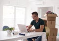 Young man moving in a new home Royalty Free Stock Photo