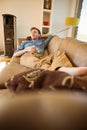 Young man napping on his couch Royalty Free Stock Photo