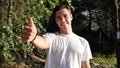 Young man in nature doing thumb up Royalty Free Stock Photo