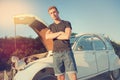 Young man near a broken car Royalty Free Stock Photo