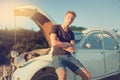 Young man near a Broken car Royalty Free Stock Photo