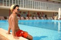 Young man near pool Royalty Free Stock Photo