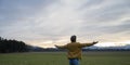 Young man practicing mindfulness standing in nature