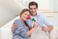 Young man offering a rose to his girlfriend Royalty Free Stock Photo