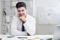 Young man at office table Royalty Free Stock Photo