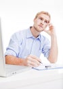 Young man at office thinking