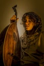 Young Man with Old Oud Guitar Lute Royalty Free Stock Photo