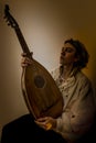 Young Man with Old Oud Guitar Lute Royalty Free Stock Photo