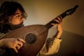 Young Man with Old Oud Guitar Lute Royalty Free Stock Photo