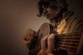 Young Man with Old Oud Guitar Lute Royalty Free Stock Photo