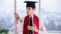 Young man at online university graduation