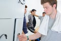 Young man opening locker