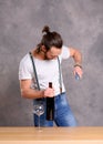 Young man opening red wine Royalty Free Stock Photo