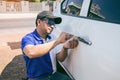 Young Man Opening White Car Door With Lockpicker Royalty Free Stock Photo