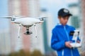 Young man operating of flying drone at sunset Royalty Free Stock Photo