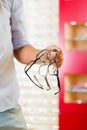 Young man at optician with glasses Royalty Free Stock Photo