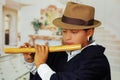 Young man from Otavalo, Ecuador, playing the quena flute