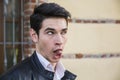 Young man outdoor doing silly face and stupid Royalty Free Stock Photo