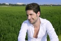 Young man outdoor happy in green meadow Royalty Free Stock Photo