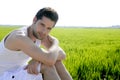 Young man outdoor happy in green meadow Royalty Free Stock Photo