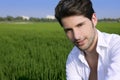 Young man outdoor happy in green meadow Royalty Free Stock Photo