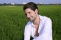 Young man outdoor happy in green meadow Royalty Free Stock Photo