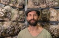 Young man - owner of domestic mushroom greenhouse.