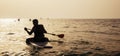 Young Man Paddleboarding