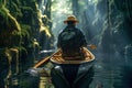 Young man is paddling a canoe on forest river. Royalty Free Stock Photo