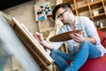 Young man painting on canvas Royalty Free Stock Photo