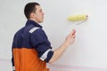 Young man with painting roller for walls Royalty Free Stock Photo