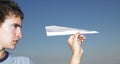 Young Man with Paper Airplane Royalty Free Stock Photo