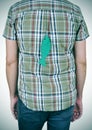 Young man with a paper fish attached to his back Royalty Free Stock Photo