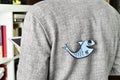 Young man with a paper fish attached to his back Royalty Free Stock Photo