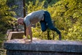 Young man parkour jumping over a stone wall in nature Royalty Free Stock Photo