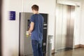 Young Man Paying For Car Parking At Machine Royalty Free Stock Photo