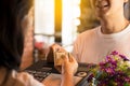 Young man paying cash at cafe and restaurant. Royalty Free Stock Photo