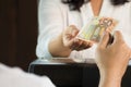 Young man paying cash at retail shop. Royalty Free Stock Photo