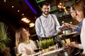 Young man paying with contactless credit card in the restaurant Royalty Free Stock Photo