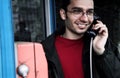 Young man on payphone Royalty Free Stock Photo