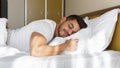 Young man peacefully sleeping in his bed Royalty Free Stock Photo