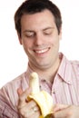 Young man pealing a banana
