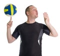 Young man performing trick with volley ball Royalty Free Stock Photo