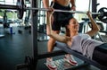 Personal trainer helping woman to working out in gym. Healthy lifestyle sport people concept Royalty Free Stock Photo