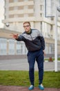 Young man petanque player throws Royalty Free Stock Photo