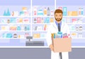 Pharmacist in pharmacy holds bag with medicines Royalty Free Stock Photo