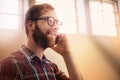 Young man, phone call and vision with glasses in discussion, communication or networking at home. Happy male person or Royalty Free Stock Photo